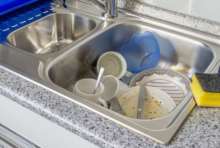 doing dishes in bathroom sink